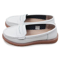 White loafers with brown soles on a white background