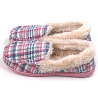 Pink and teal tartan slippers with beige/cream furry ankle cuffs. Pink rubber soles. Side view.