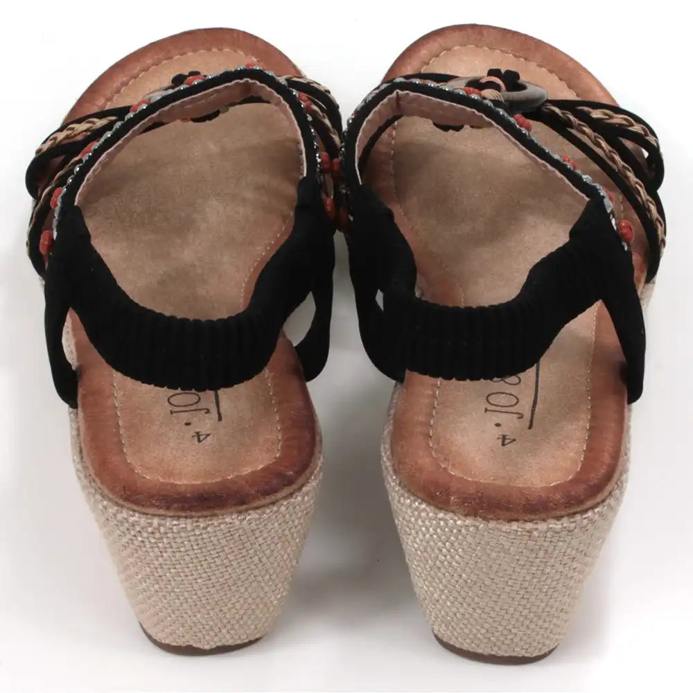 Black, strappy, wedge sandals. Peep toed with beads and fabric decoration on the straps. Elasticated slingback fitting. Hessian look wedge heels and sole sides. Back view.