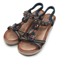 Wedge sandals with woven details.