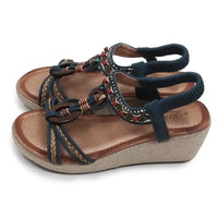 Wedge sandals with woven details.