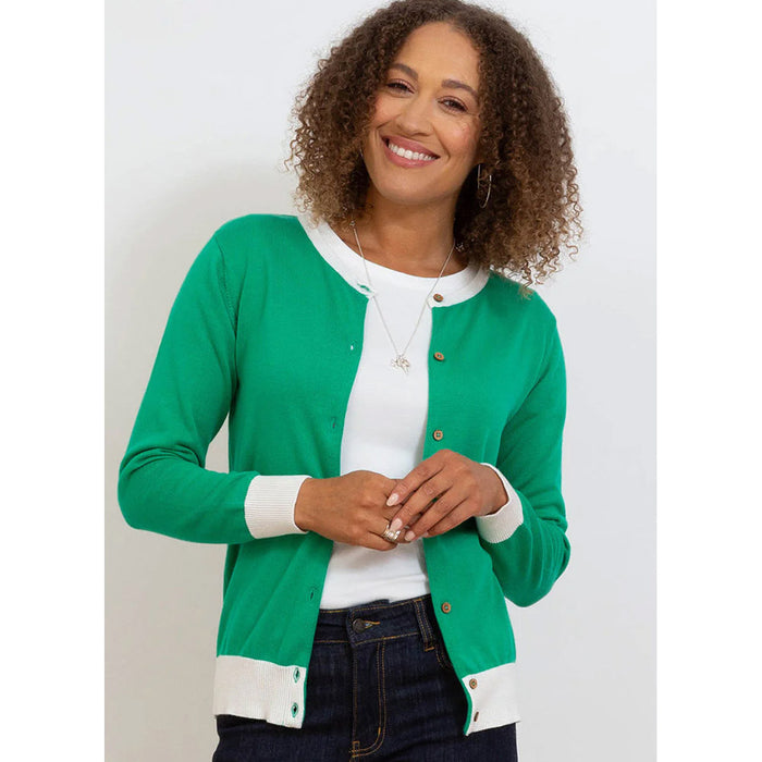 Kite grass green cardigan with white neckline, around the waist and cuffs. Front view.