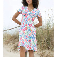 Woman wearing a floral dress on a beach