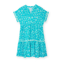 Front of a pale blue dress with a floral paisley print in white. Short sleeves and v neckline. 