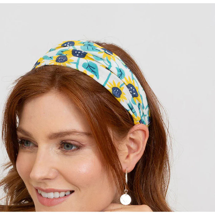 Kite sunflower headband being worn by a model.