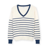 White jumper with horizontal navy stripes and a navy trim on V neckline and cuffs of long sleeves. 