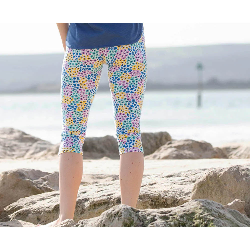 Kite brightly coloured over the knee leggings. Back view.