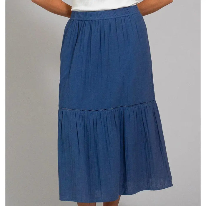 Front of a navy blue tiered skirt that falls below the knee. 