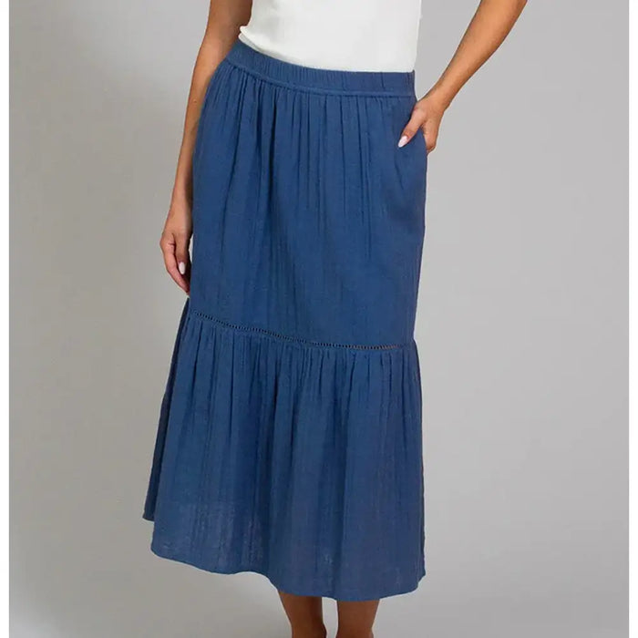 Front of a navy blue tiered skirt that falls below the knee. 