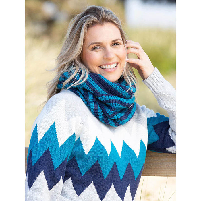 Kite knitted snood in dark blue and teal. Worn by a model.