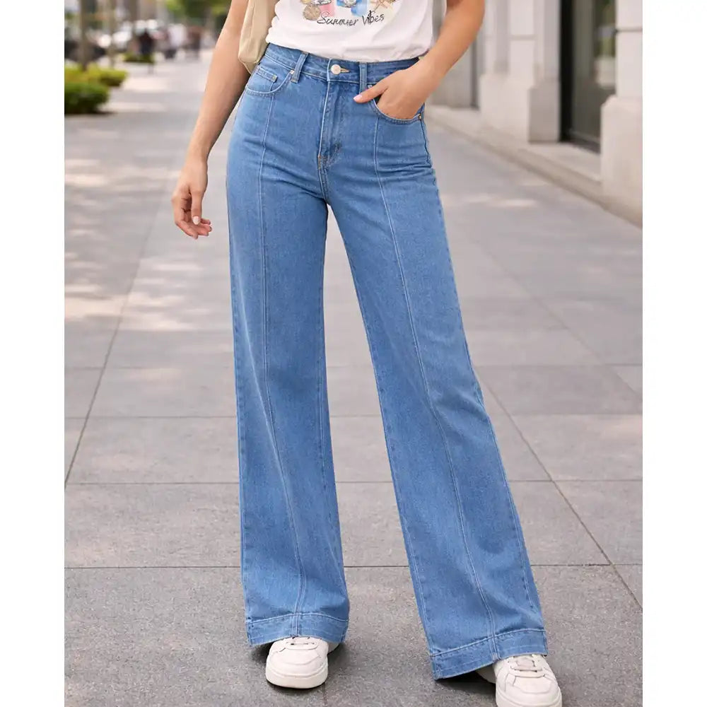 Person wearing blue jeans on a city street