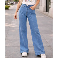 Person wearing blue jeans on a city street
