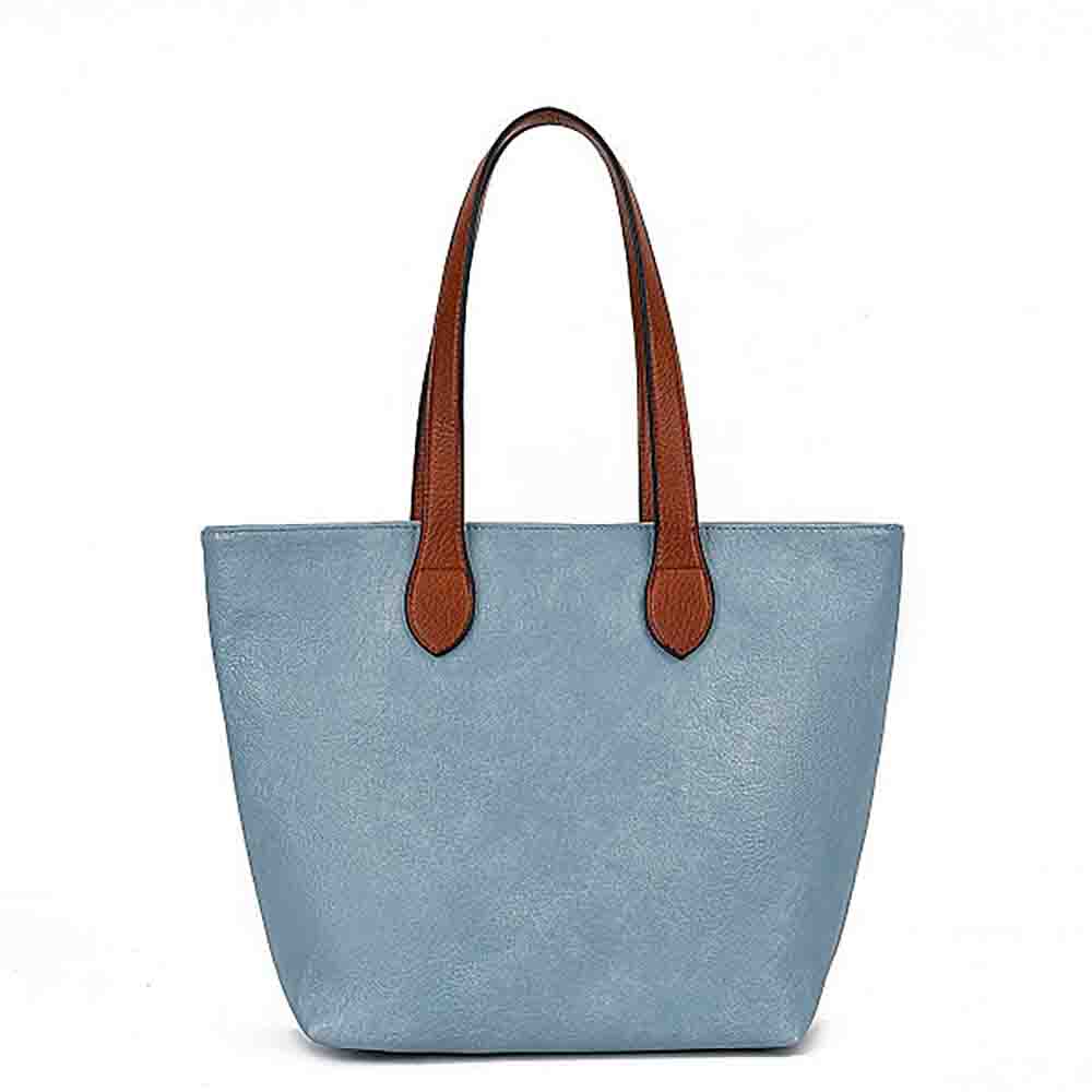 A light blue faux-leather tote bag with brown  handles, shown against a plain white background.