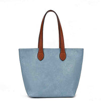 A light blue faux-leather tote bag with brown  handles, shown against a plain white background.