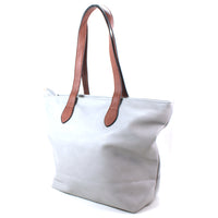 White tote bag with brown shoulder straps on a white background.