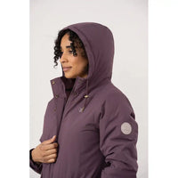 Woman wearing a purple hooded jacket on a white background