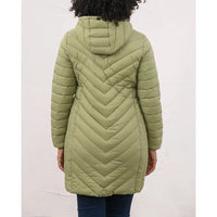 A person shown from the back wearing a hooded quilted puffer coat in an olive green color, paired with dark blue jeans, against a plain off-white wall.