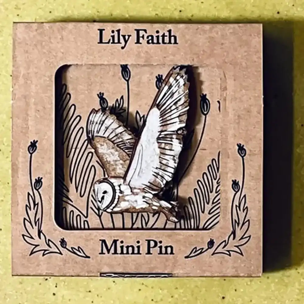 A wooden barn owl mini pin with spread wings displayed inside a square kraft paper window box labeled 'Lily Faith' and 'Mini Pin'.