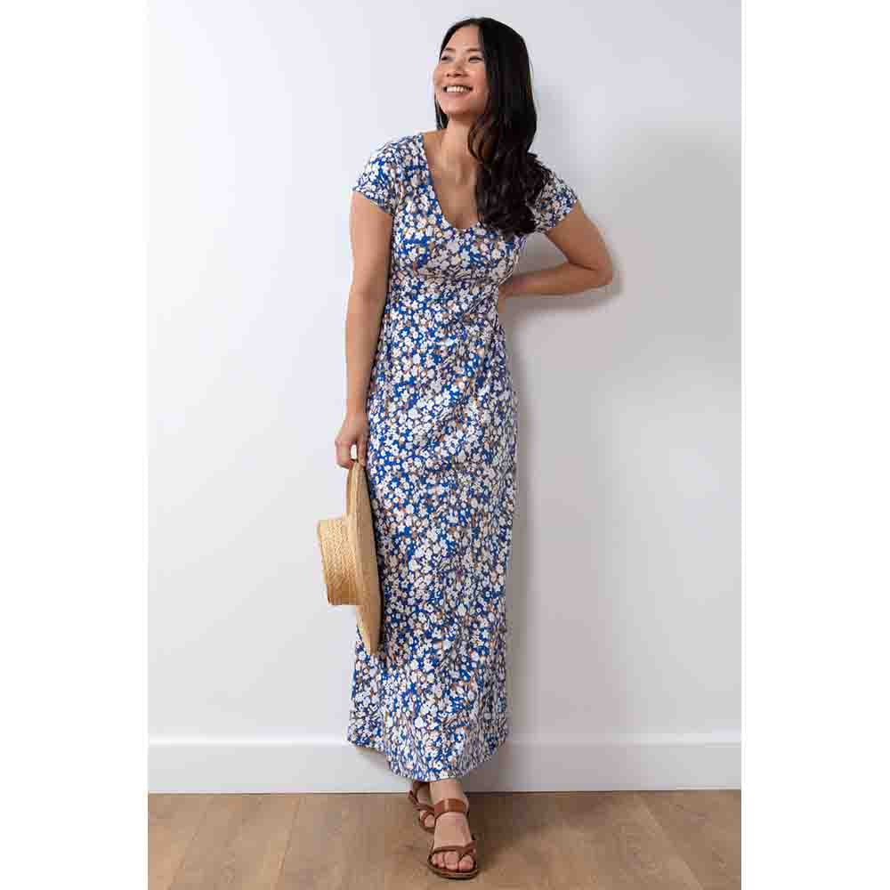 Cobalt, beige and white flowers on a maxi dress with a gathered fitted waist, short sleeves and rounded neckline 