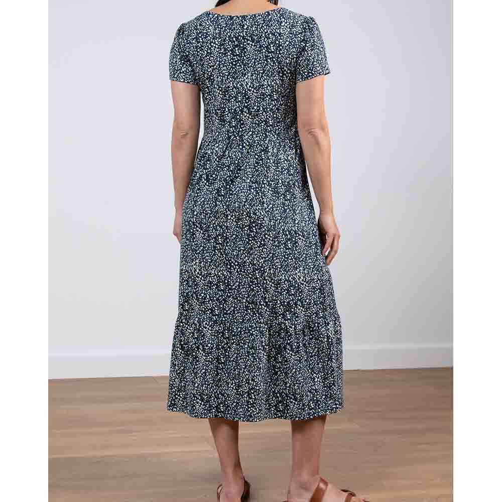 Navy blue dress with white dashes, short sleeves and falls to mid-calf length