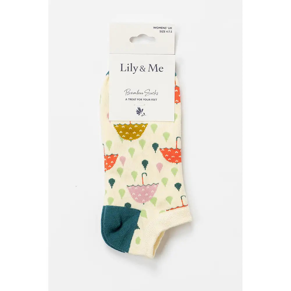 Packaged socks with colorful umbrella pattern and 'Lily & Me' branding on a white background