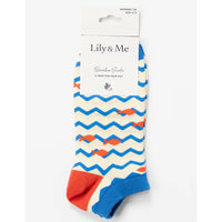 Packaged sock with blue and orange zigzag pattern on a white background, branded 'Lily & Me'.