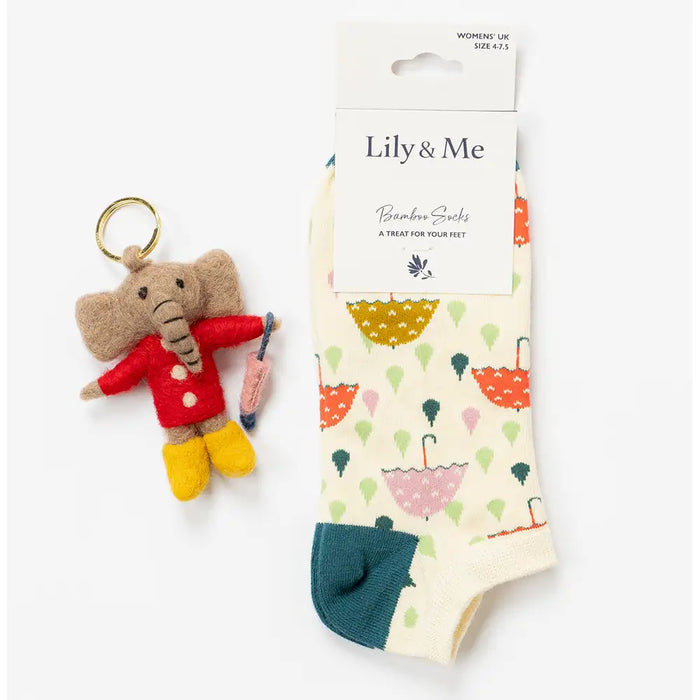 Keychain elephant and socks with umbrella pattern on a white background