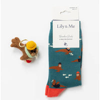 Teal socks with otter design and keychain on a white background, featuring 'Lily & Me' packaging.