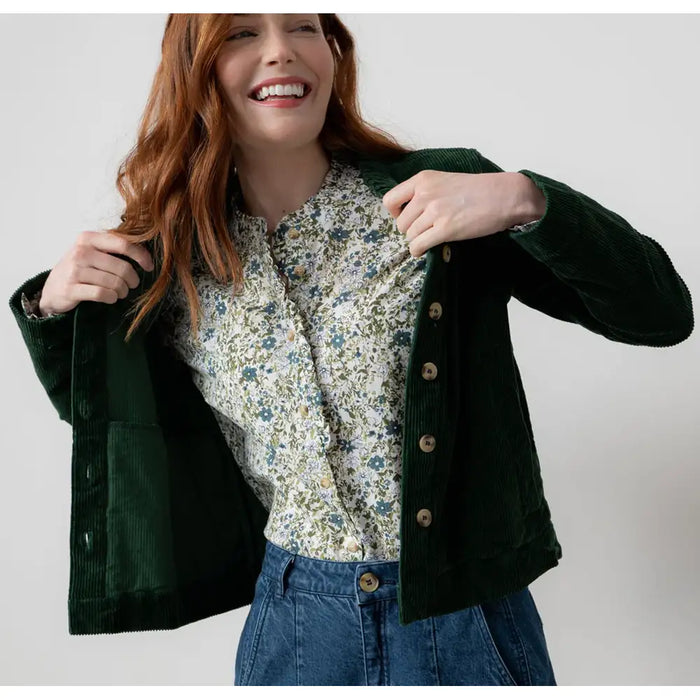 Front of a green front buttoning jacket with long sleeves