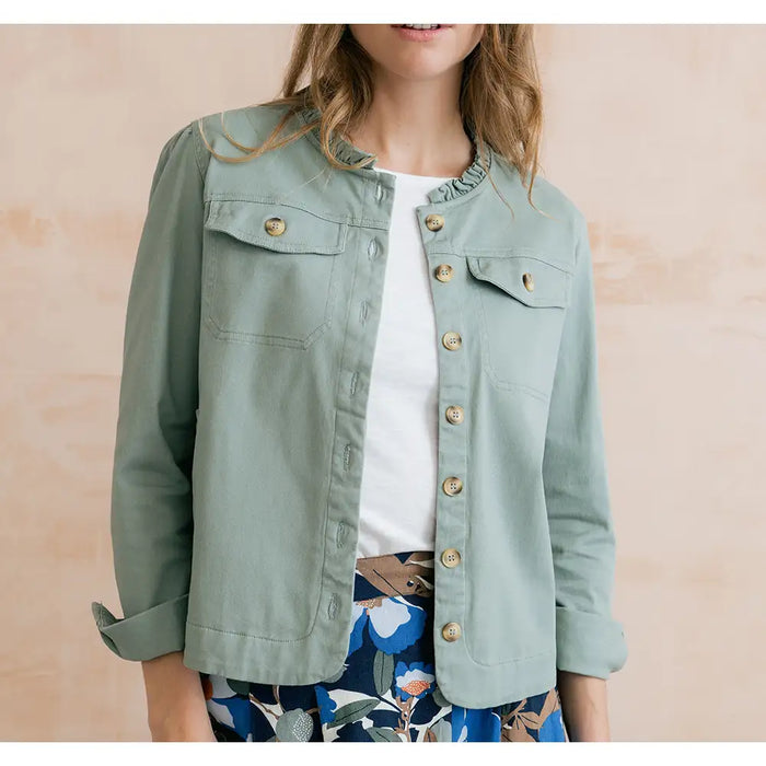 Pale green jacket open at the front with buttons and turned up long sleeves. Ruffle pie collar and pockets on the breast.