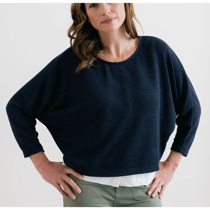 Front of round neck bat wing jumper in navy. 3/4 sleeves. 