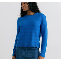 Front of a cobalt blue jumper with scalloped round neck and cuffs on long sleeves. Horizontal pointelle detailing across the body and arms.