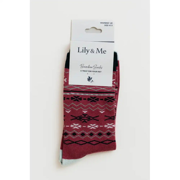 A pair of Lily & Me brand bamboo socks in a red, black, and white Nordic pattern, packaged on a white cardboard hanger against a light gray background.