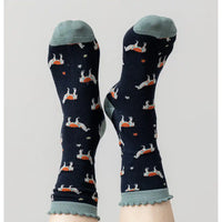 Pair of socks with a pattern on a light gray background