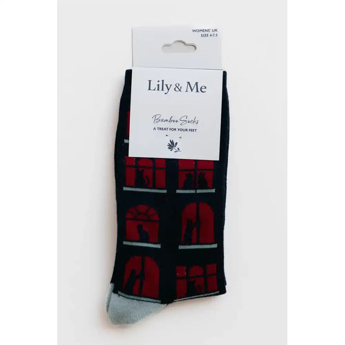 A single pair of Lily & Me brand bamboo socks in black and red, packaged in their original white cardboard retail packaging against a plain white background.