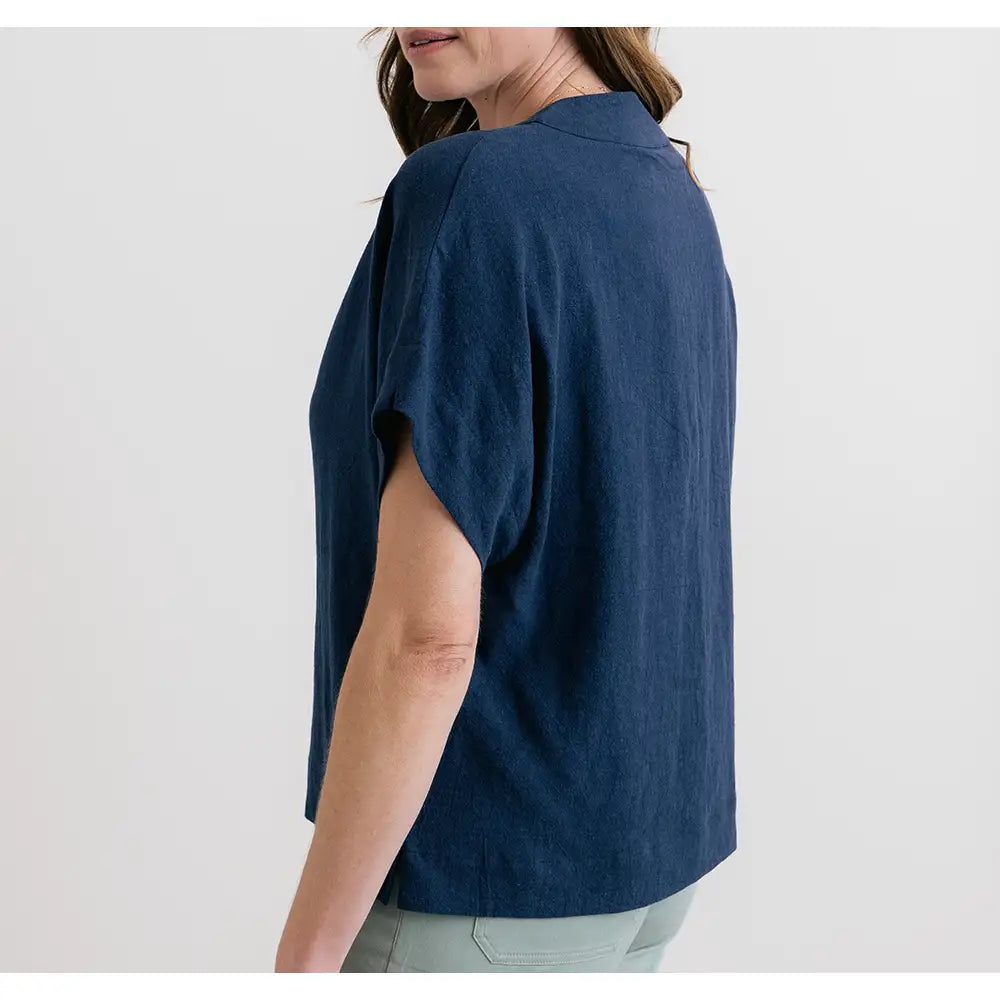 Person wearing a blue shirt on a white background
