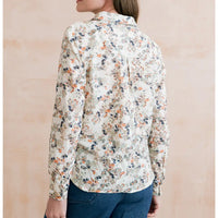 Ecru based shirt with collar and long turned up sleeves. Has a delicate floral pattern on it. 