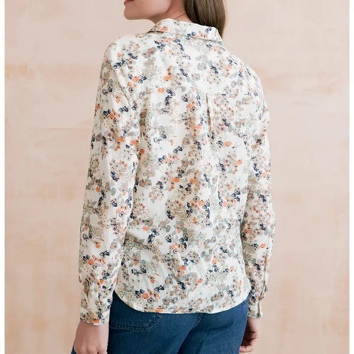 Ecru based shirt with collar and long turned up sleeves. Has a delicate floral pattern on it. 
