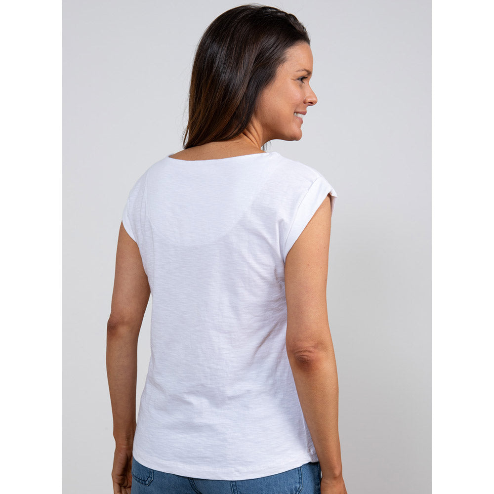 Brown haired women facing with back to you wearing a white short sleeve top