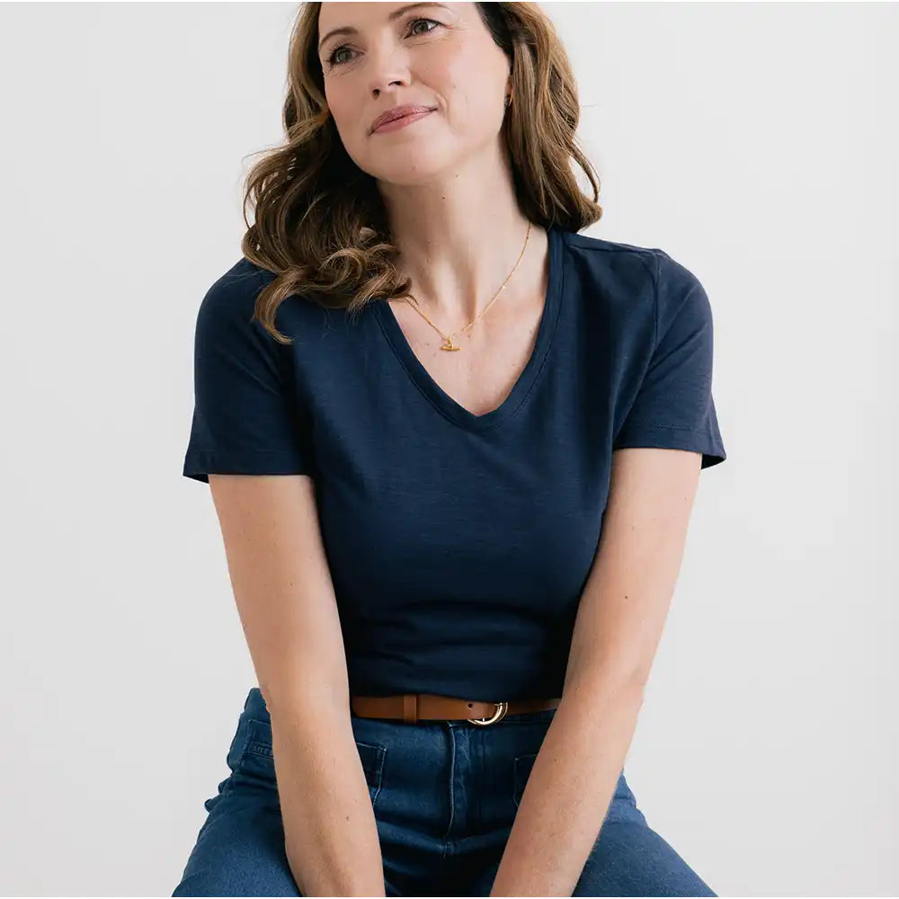 Navy blue top with short sleeves and V neck line