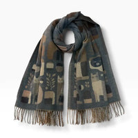 Denim Blue scarf with tassels on a white background. Abstract cats feature on the scarf.