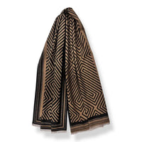 Black and Brown scarf with a geometric maze print. A light gray background