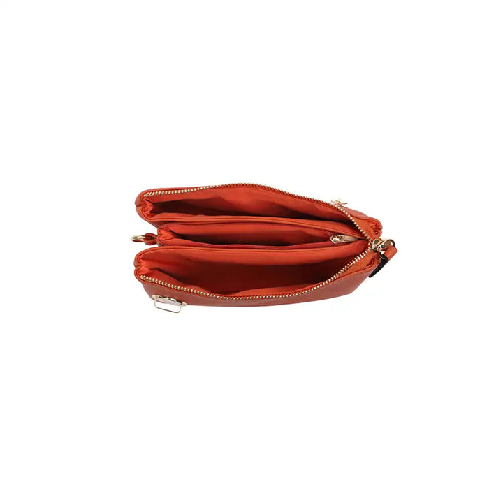 The inside of a small cross-body bag in brown faux leather on a white background