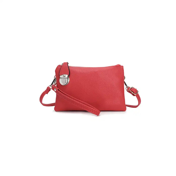 Red small cross-body bag with a strap on a white background