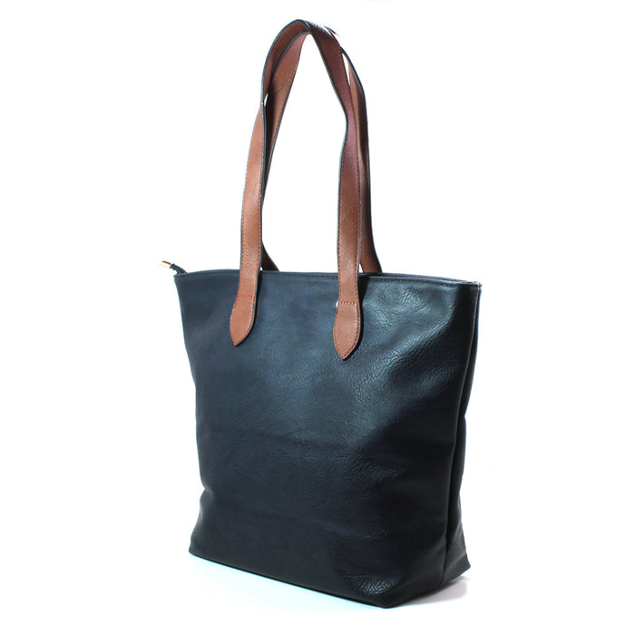 A dark blue leather look tote bag with contrasting brown  shoulder straps, shown from a three-quarter angle against a plain white background.