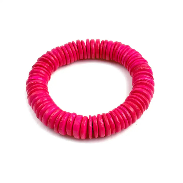 Pink coiled bracelet on a white background