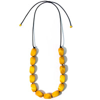Necklace with yellow beads on a white background