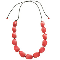 Necklace with red beads on a white background