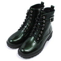 Pair of patent green combat boots with black laces on a white background