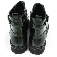 Pair of patent green combat boots with black laces on a white background
